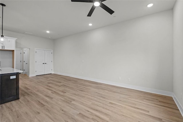 3058 W Berkeley Ave, Rogers, AR 72758 - unfurnished living room with ceiling fan, light wood finished floors, and recessed lighting