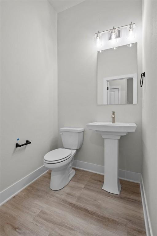 3058 W Berkeley Ave, Rogers, AR 72758 - bathroom with toilet and wood finished floors
