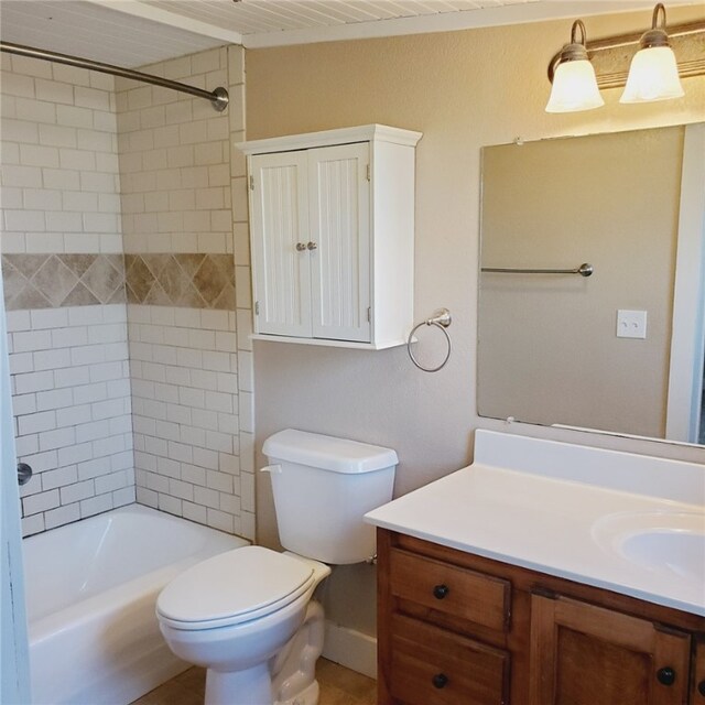 bathroom featuring shower / bath combination, vanity, and toilet