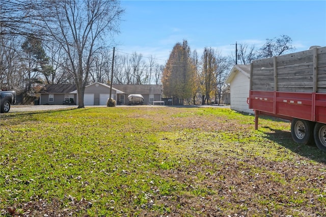 view of yard featuring a garage