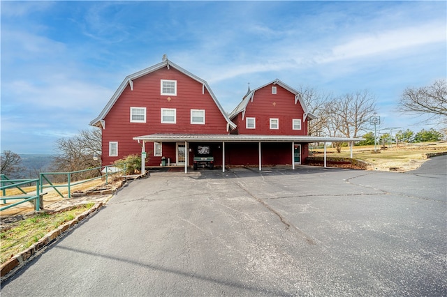 view of front of home with a carport