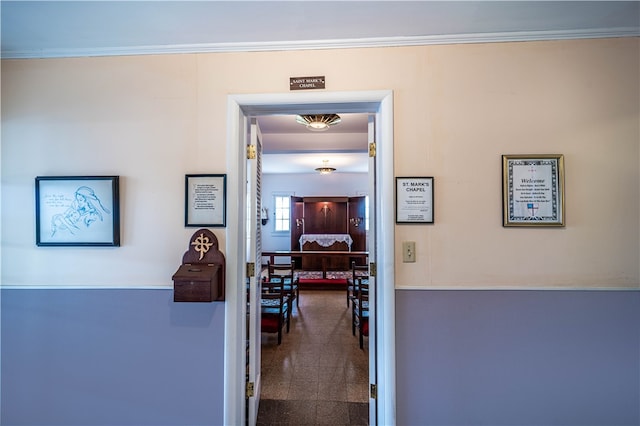 hallway featuring ornamental molding