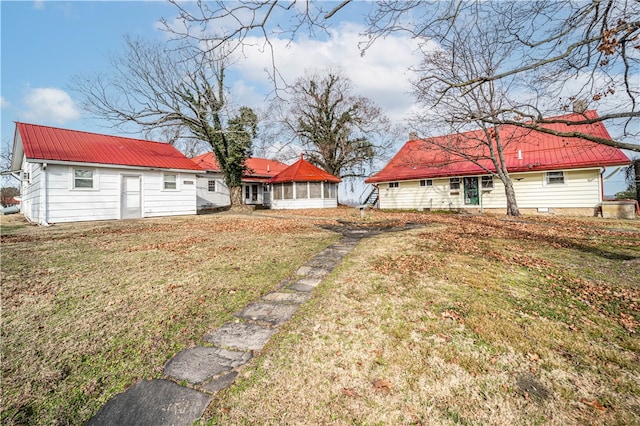 view of yard featuring a sunroom