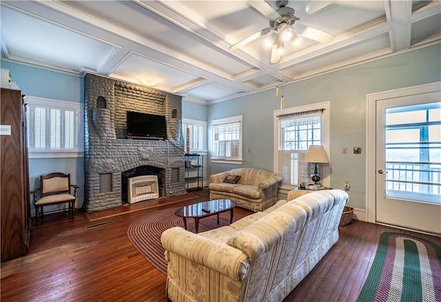 living room featuring coffered ceiling, dark hardwood / wood-style floors, ceiling fan, and a brick fireplace