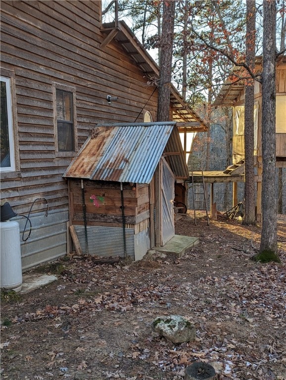 exterior space featuring a storage unit