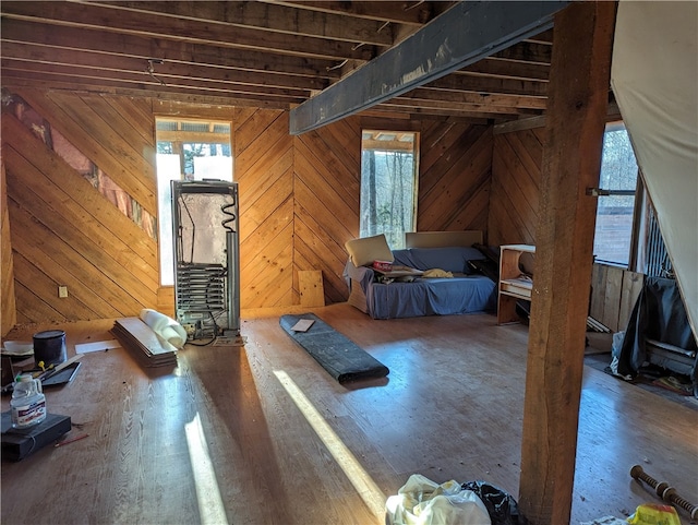 unfurnished bedroom featuring wood walls