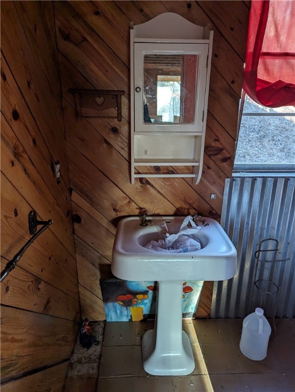 bathroom featuring wood walls