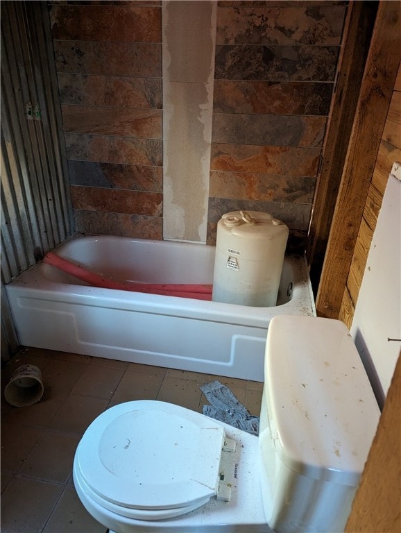 bathroom with tile flooring and toilet