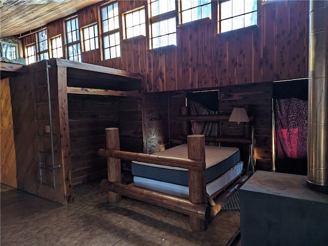 bedroom with wood walls