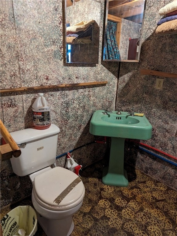 bathroom with tile flooring and toilet