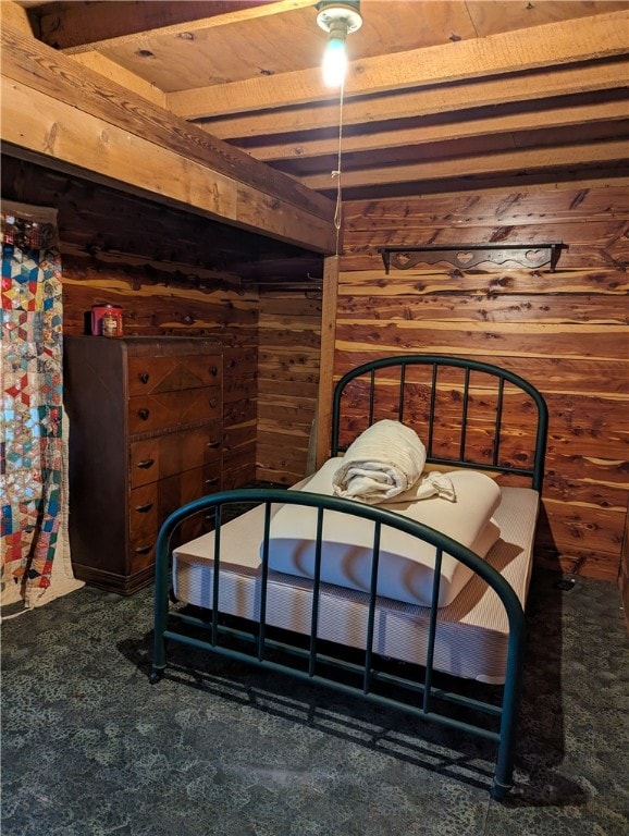 bedroom featuring wood ceiling and wooden walls