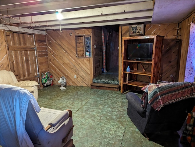 interior space with wooden walls and tile floors