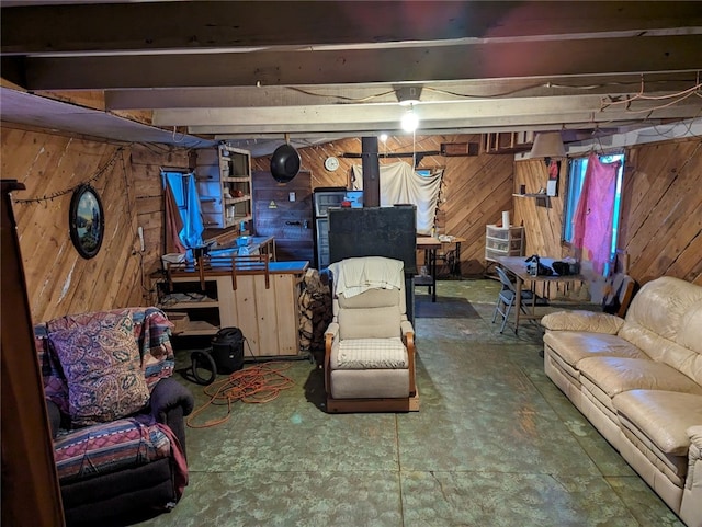 basement featuring wooden walls