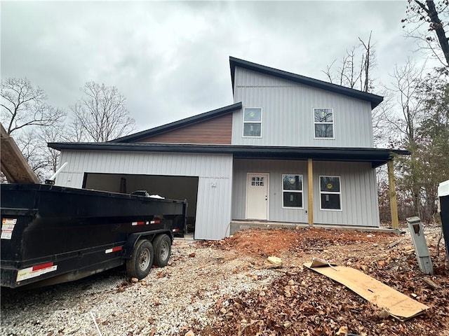 view of front facade with a porch and a garage