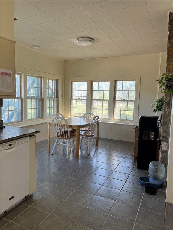 dining area with dark tile flooring