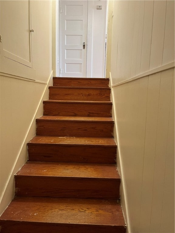 stairs with hardwood / wood-style flooring