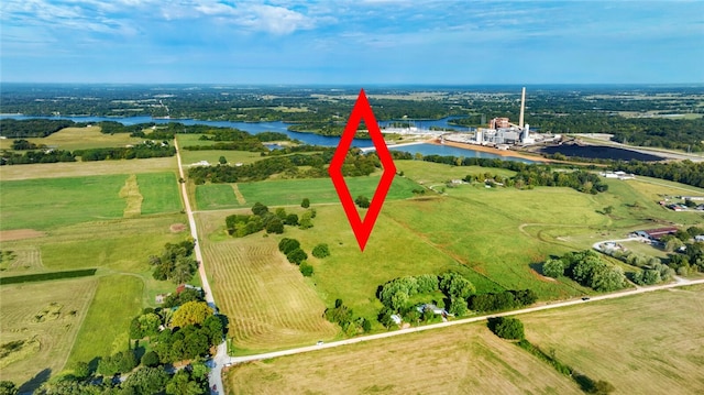 birds eye view of property with a rural view and a water view