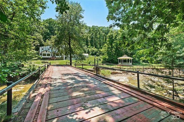 view of nearby features with a gazebo and a deck with water view