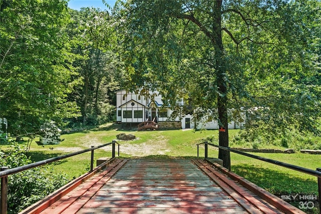 view of home's community with a lawn