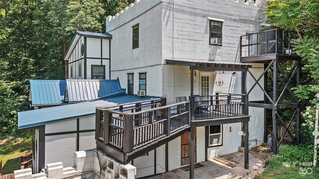 back of house featuring a wooden deck