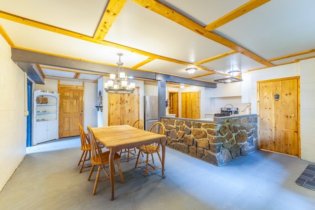 dining space featuring a notable chandelier and beamed ceiling