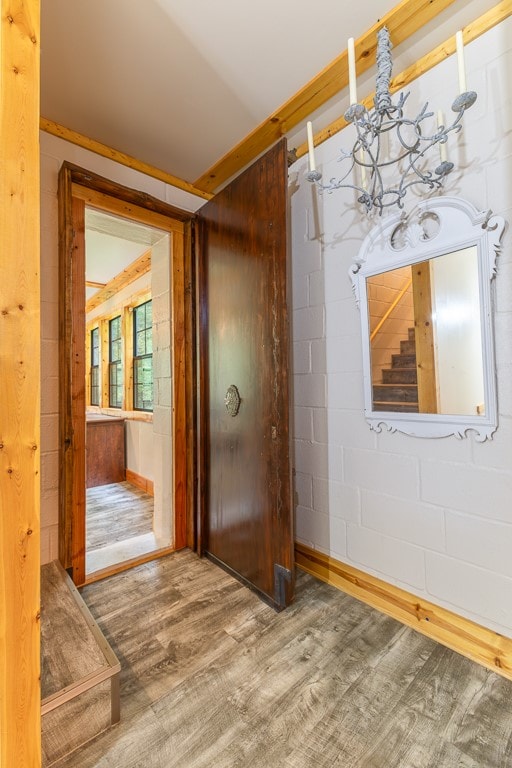 interior space with an inviting chandelier and hardwood / wood-style floors