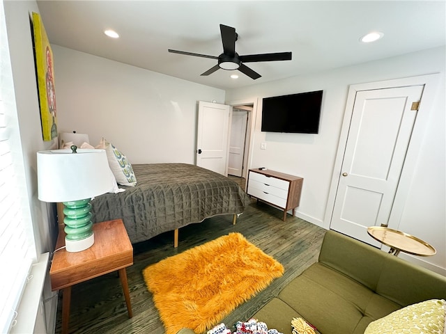 bedroom featuring ceiling fan and dark wood-type flooring