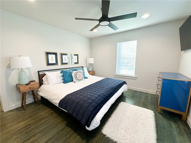 bedroom featuring ceiling fan and dark hardwood / wood-style floors