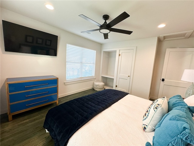 bedroom with dark hardwood / wood-style flooring and ceiling fan