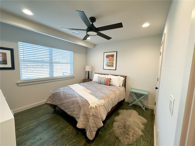 bedroom featuring ceiling fan and dark wood-type flooring