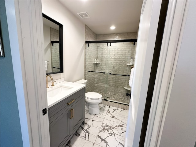 bathroom with a shower with door, tile flooring, toilet, and vanity