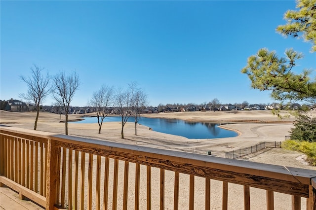 view of swimming pool featuring a water view