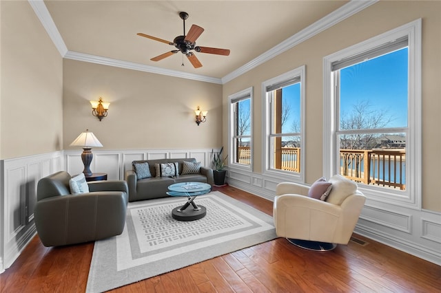 living room with dark hardwood / wood-style floors and ornamental molding