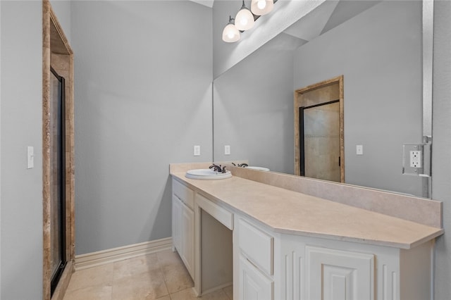 bathroom featuring tile floors, vanity, and an enclosed shower