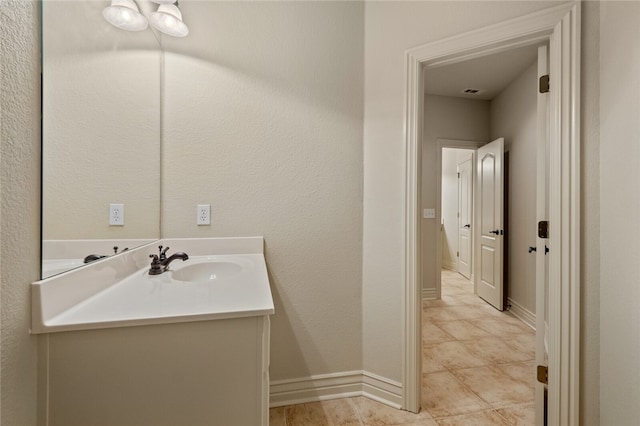 bathroom with vanity and tile floors