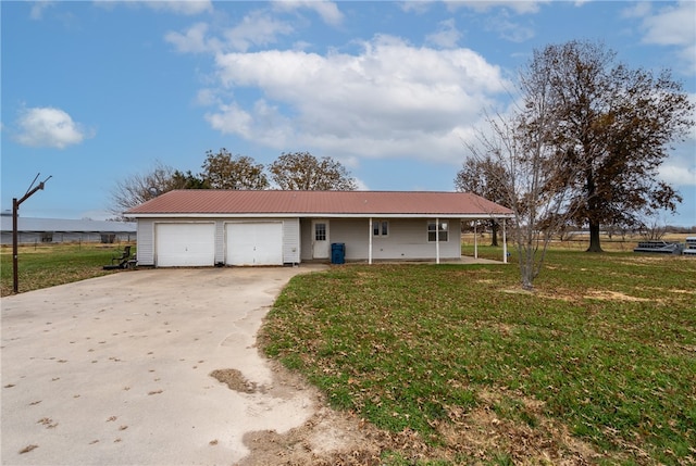 ranch-style house featuring a garage and a front lawn