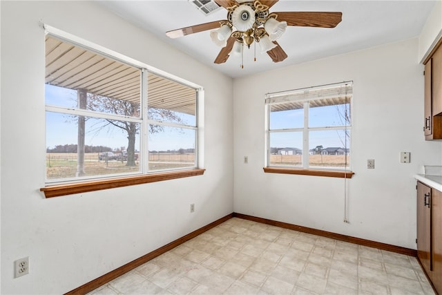 spare room with ceiling fan