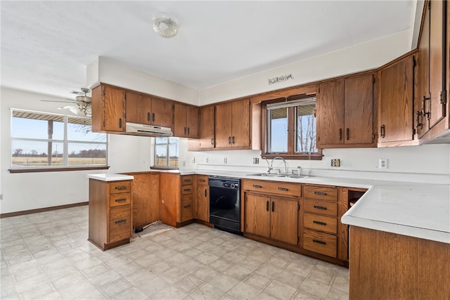 kitchen with kitchen peninsula, black dishwasher, a healthy amount of sunlight, and sink