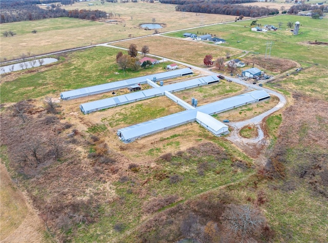 birds eye view of property with a rural view