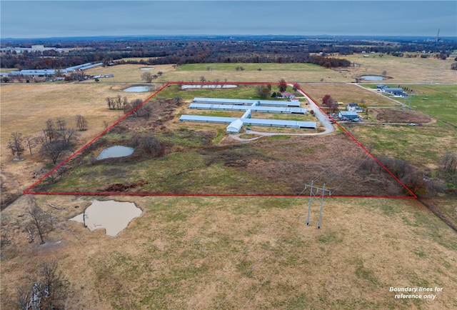 bird's eye view featuring a water view and a rural view