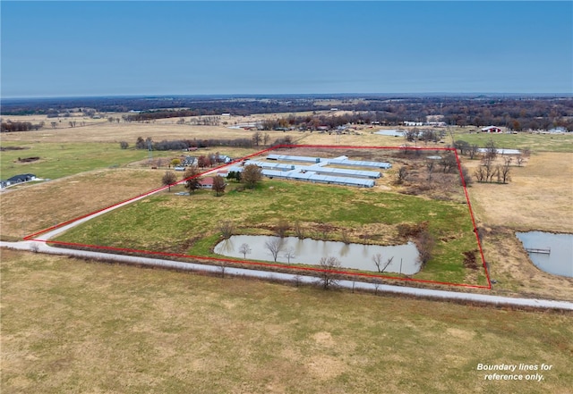 birds eye view of property with a rural view and a water view