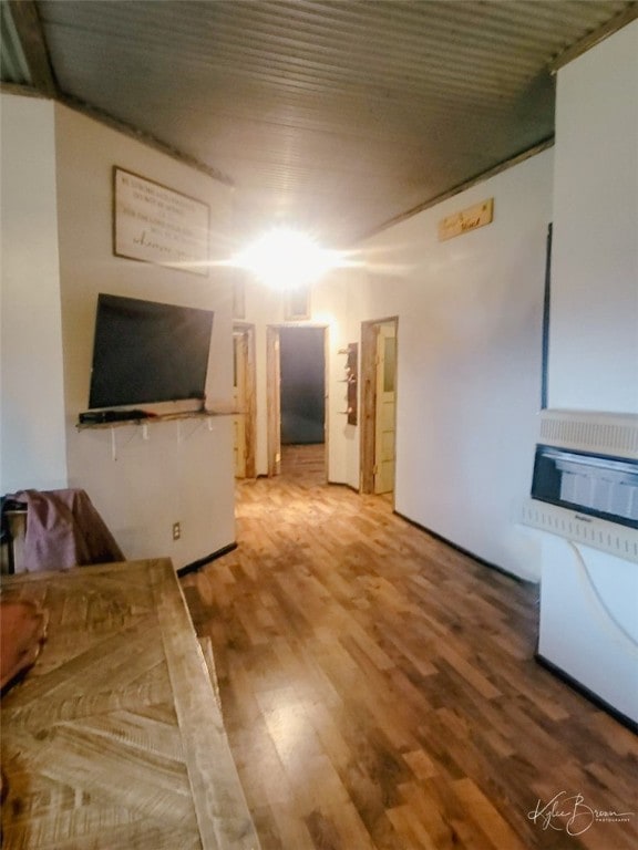 unfurnished living room with wood-type flooring