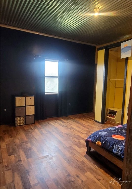 unfurnished bedroom with dark hardwood / wood-style flooring