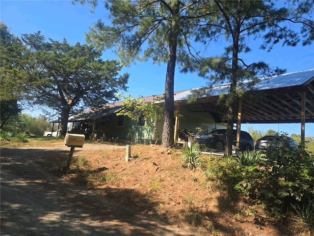 view of property exterior featuring a carport