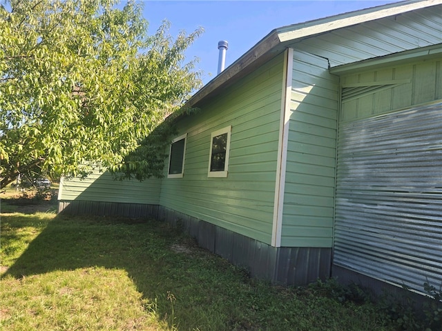 view of home's exterior featuring a lawn