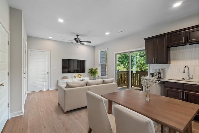 interior space featuring light wood-type flooring, ceiling fan, baseboards, and recessed lighting