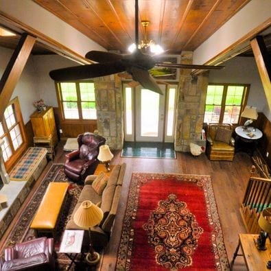 interior space with hardwood / wood-style flooring, wooden ceiling, and an inviting chandelier