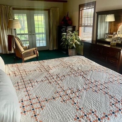 carpeted bedroom featuring french doors and access to exterior