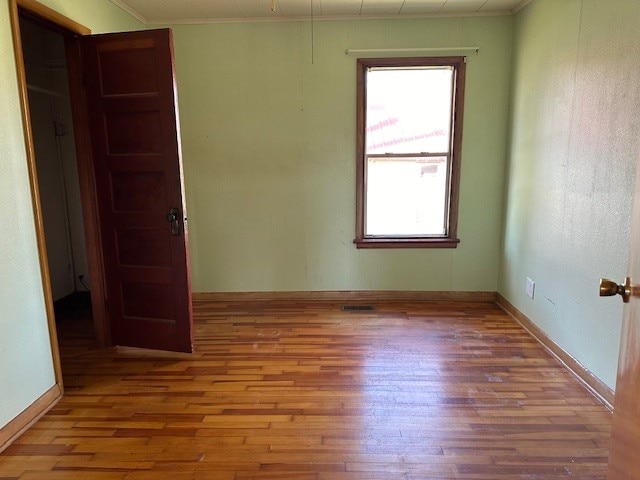 spare room featuring hardwood / wood-style flooring