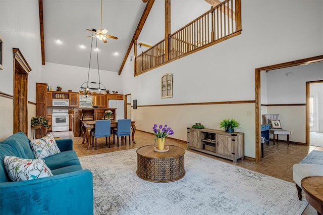 living room with beamed ceiling, tile patterned floors, high vaulted ceiling, and ceiling fan